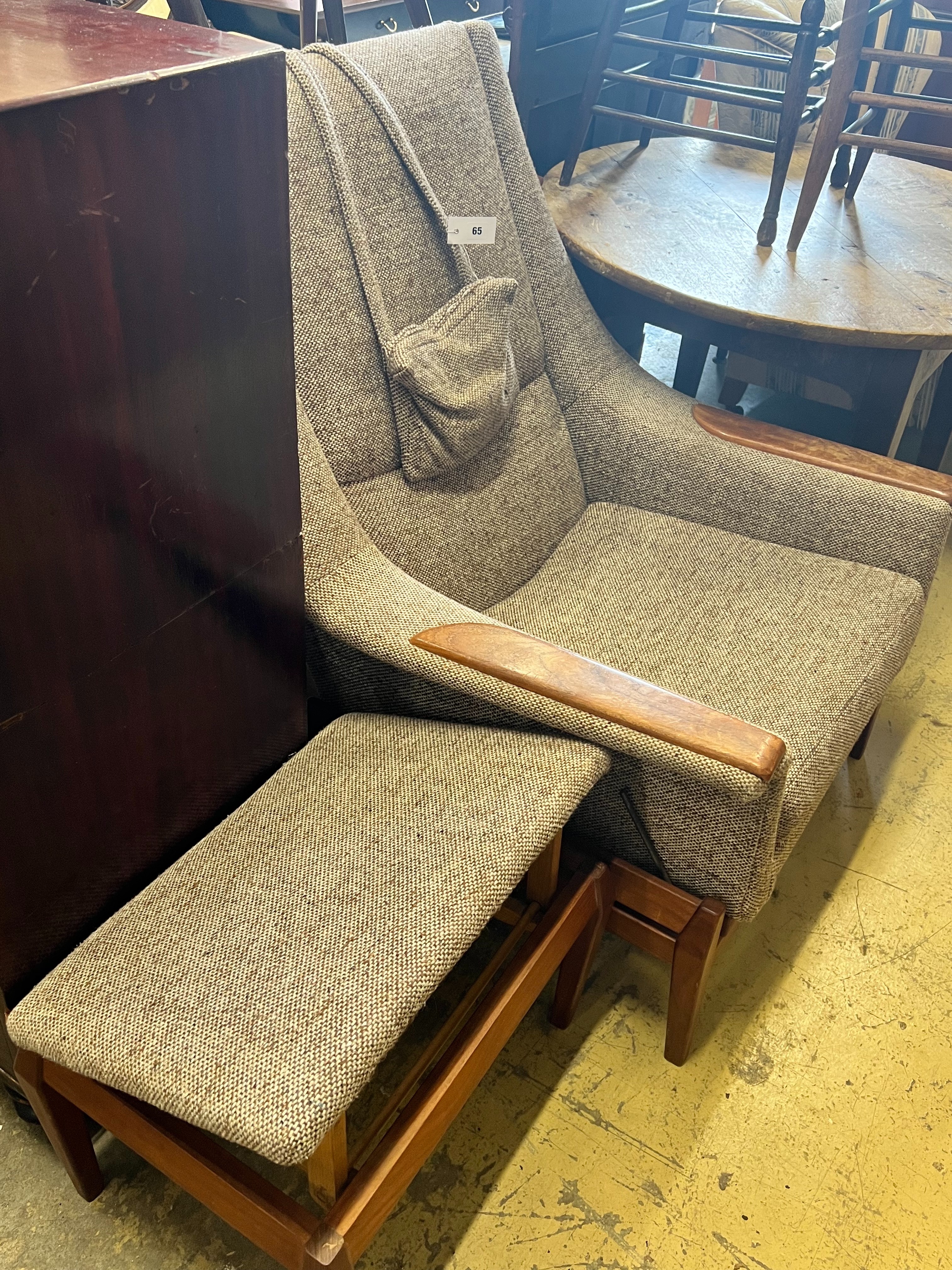 A Scandinavian upholstered armchair and foot stool, chair width 86cm depth 80cm height 102cm